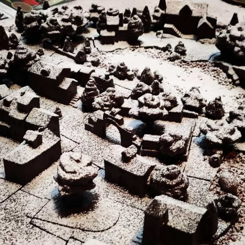 Snødekt landsby laget av sjokolade